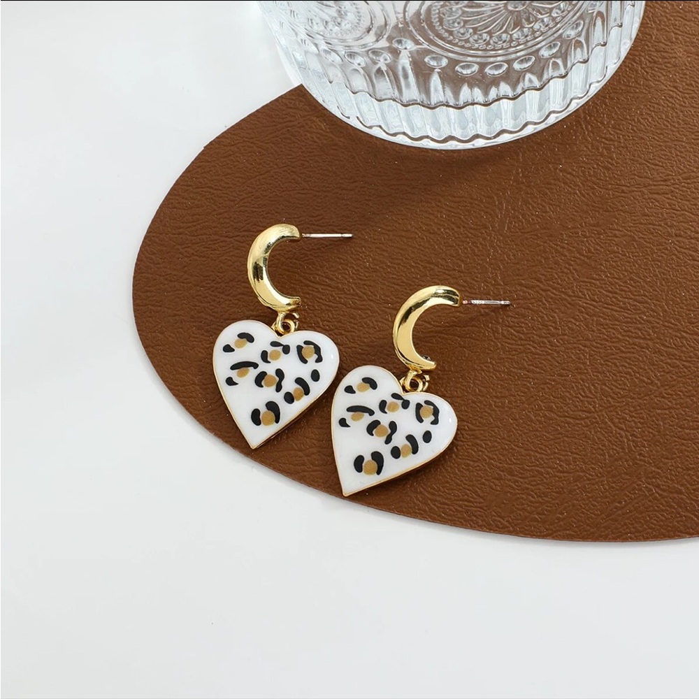 Gold c-shape hoops with leopard print heart